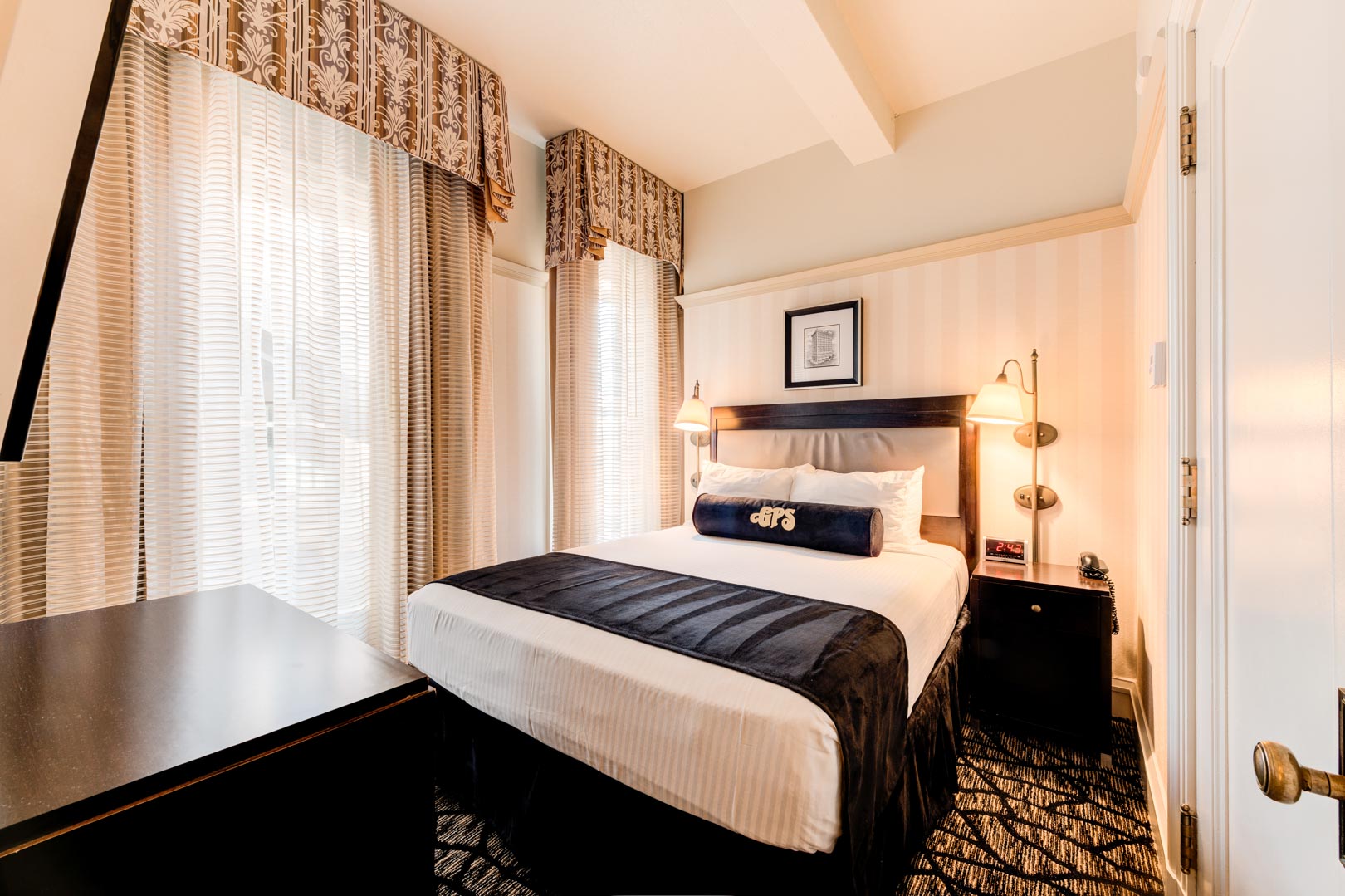 A charming master bedroom at VRI's Gaslamp Plaza Suites in San Diego, California.